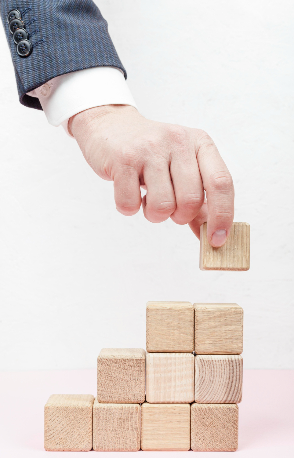 Man building blocks two